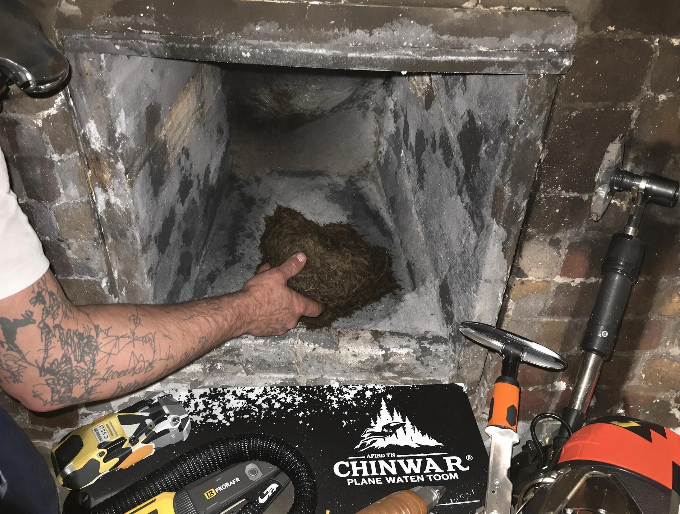 Monsey Chimney Sweep safely removing debris and screening chimney in Monsey, NY